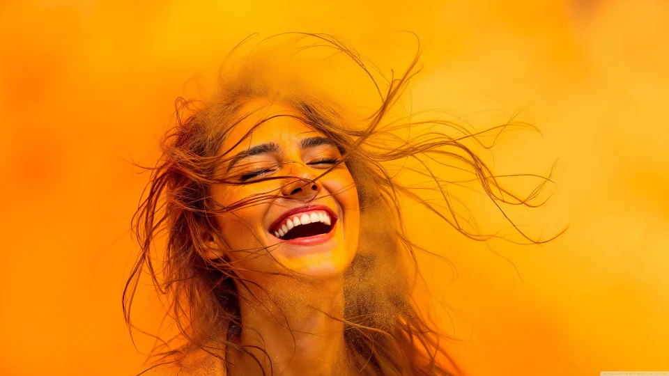 Happy Girl Laughing 4K Wallpaper Yellow Holi Powder Aesthetic - Girls wallpaper - 4K